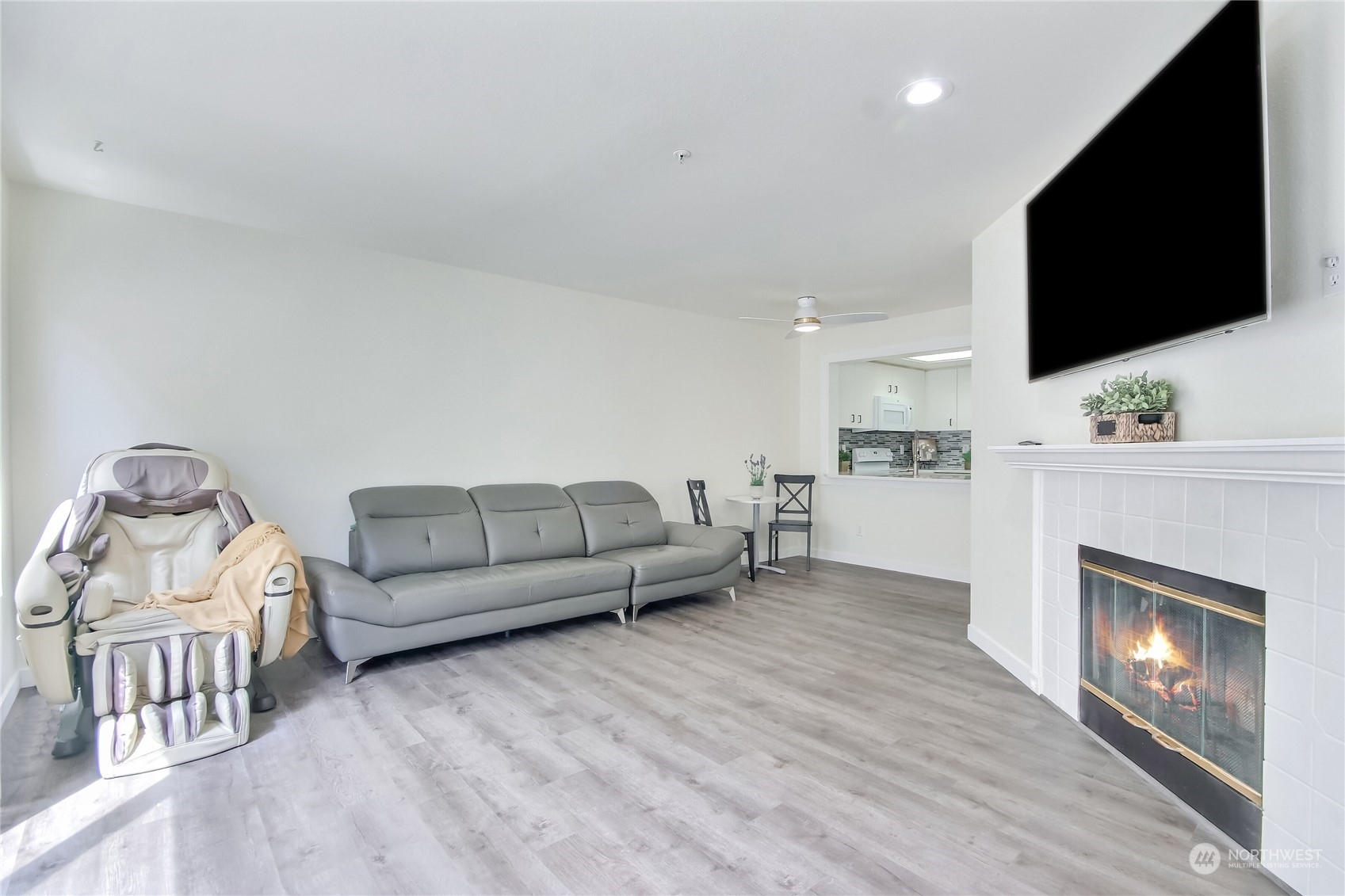 1825 South 330th Street, Unit E3 Federal Way, WA 98003 - Photo 12 of 26 a living room with furniture and a flat screen tv