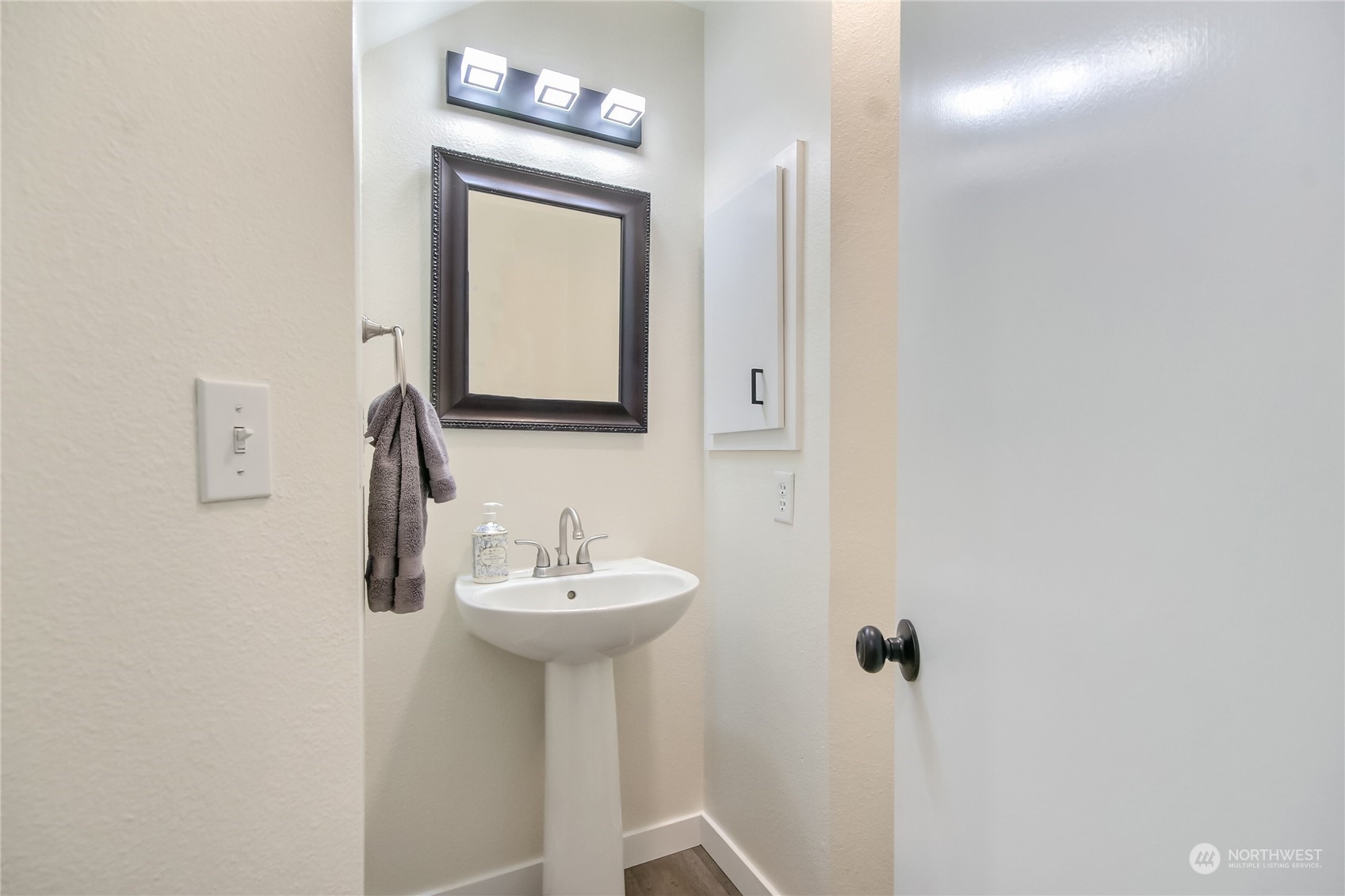 1825 South 330th Street, Unit E3 Federal Way, WA 98003 - Photo 13 of 26 a bathroom with a sink a mirror and vanity