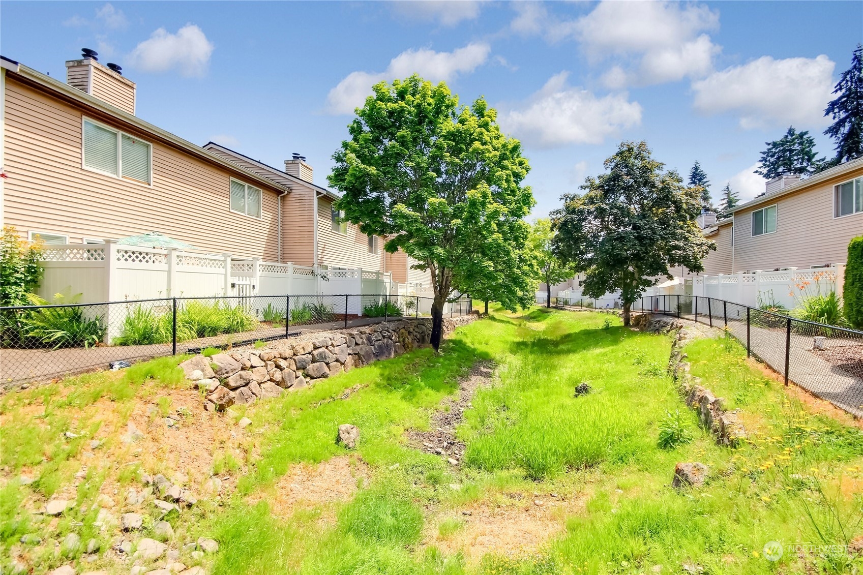 1825 South 330th Street, Unit E3 Federal Way, WA 98003 - Photo 21 of 26 a view of backyard with swimming pool
