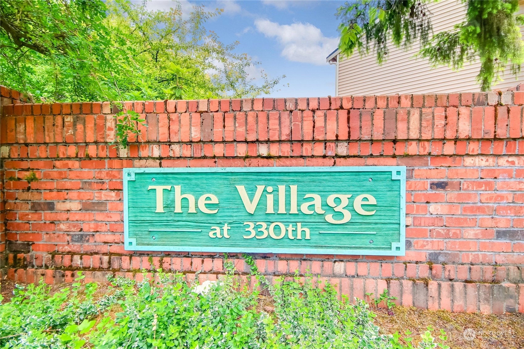 1825 South 330th Street, Unit E3 Federal Way, WA 98003 - Photo 23 of 26 a sign on the side of a building