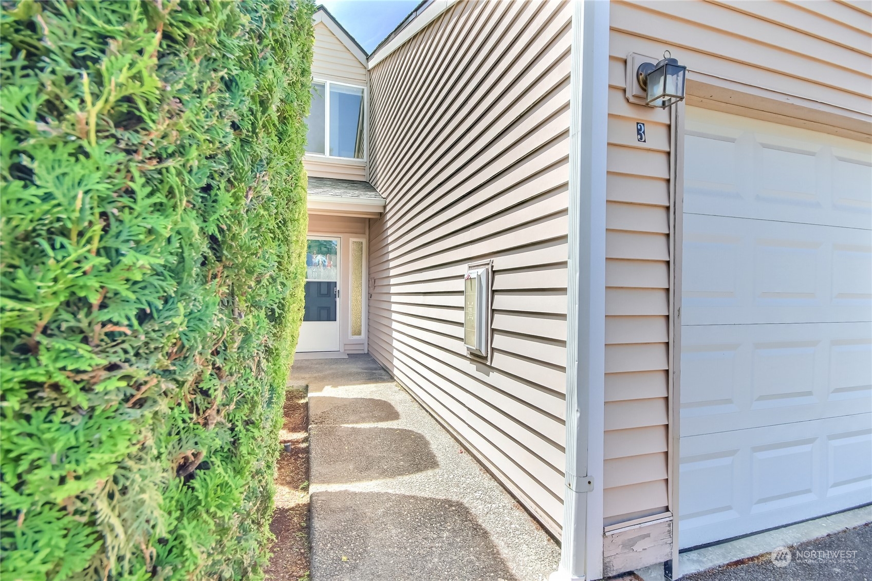 1825 South 330th Street, Unit E3 Federal Way, WA 98003 - Photo 3 of 26 a view of a house with a door and a window