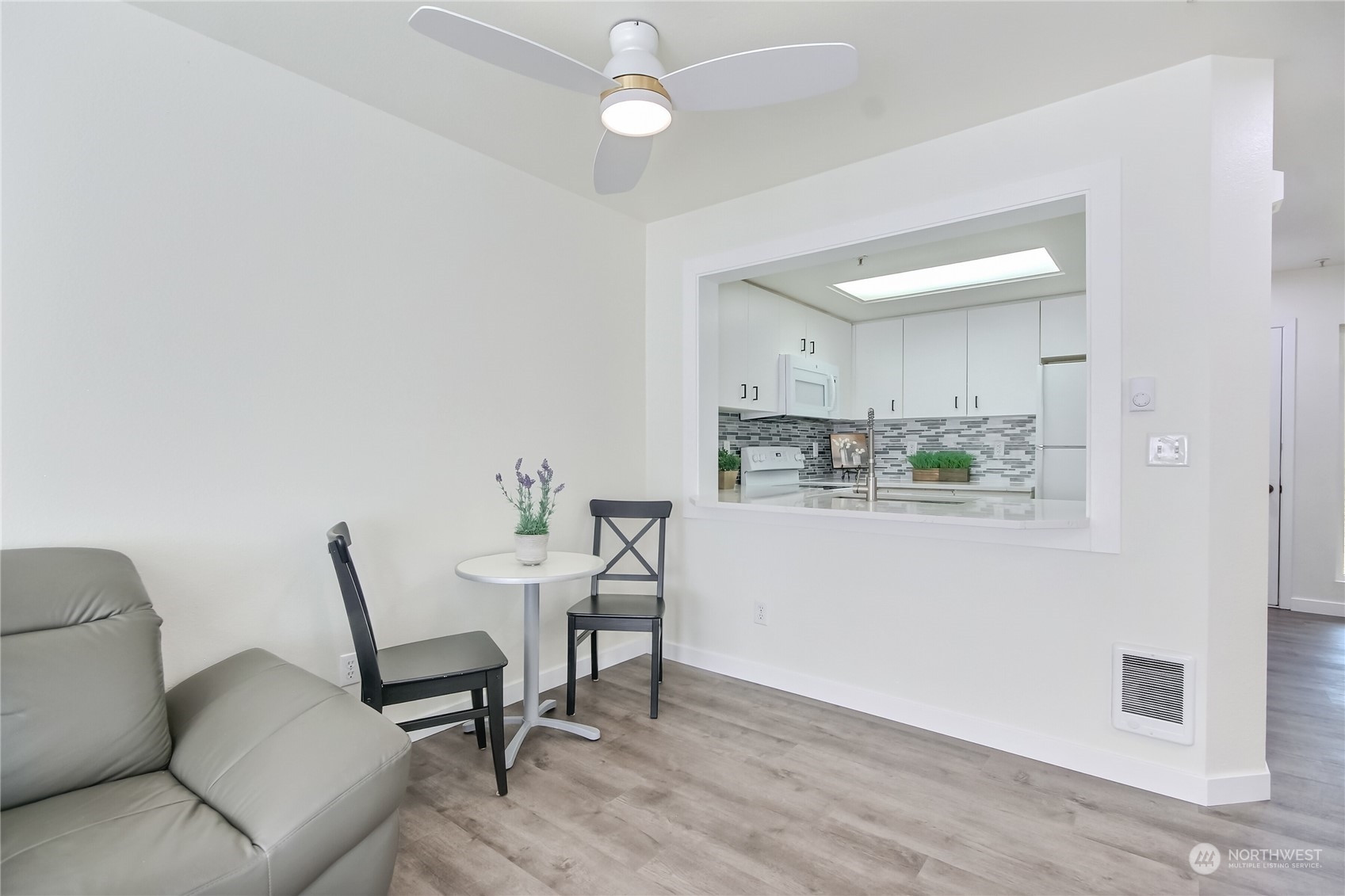 1825 South 330th Street, Unit E3 Federal Way, WA 98003 - Photo 9 of 26 a view of kitchen with furniture and wooden floor