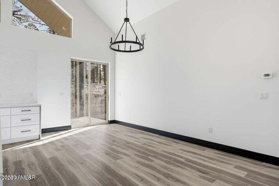 2381 West Bench Road Show Low, AZ 85901 - Photo 11 of 45 a view of a room with cabinet and wooden floor