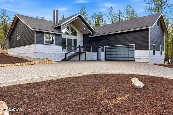 a view of house with yard and entertaining space