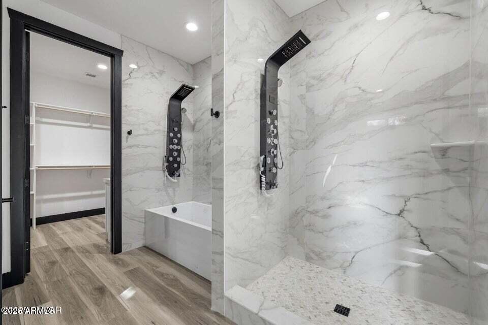 2381 West Bench Road Show Low, AZ 85901 - Photo 21 of 45 a bathroom with a bathtub and a shower