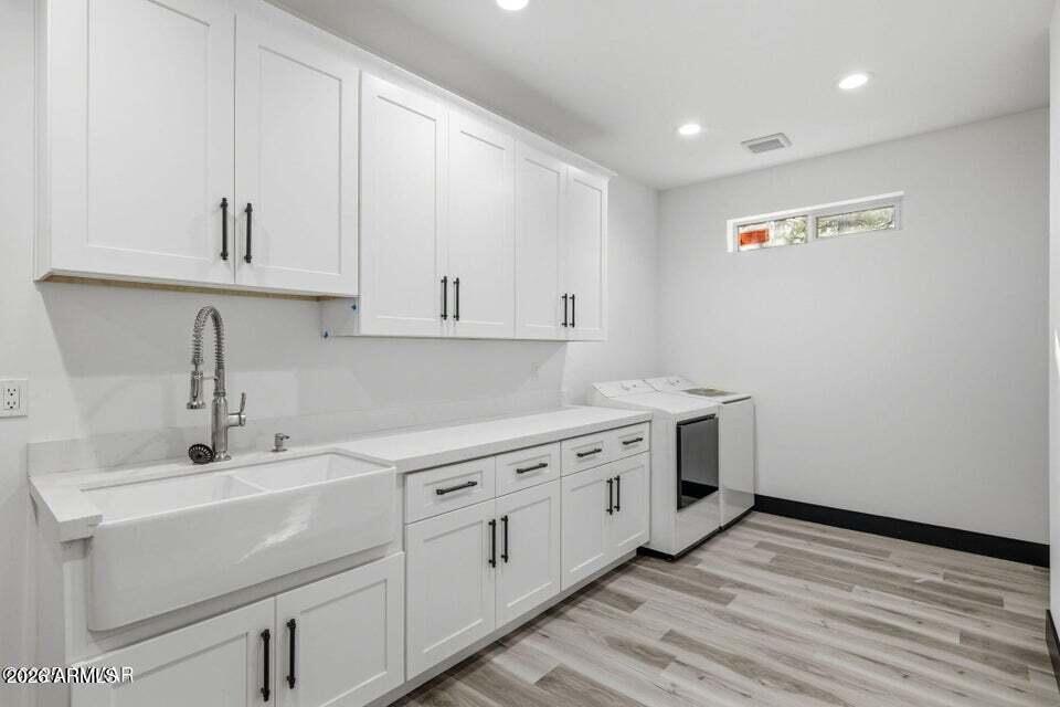 2381 West Bench Road Show Low, AZ 85901 - Photo 27 of 45 a kitchen with white cabinets sink and dishwasher