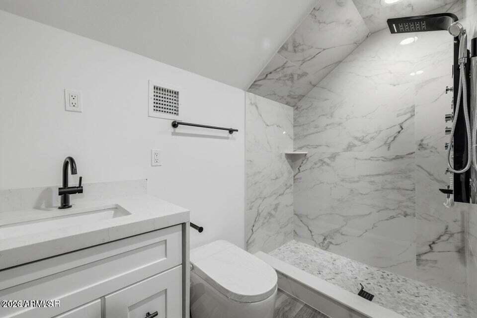 2381 West Bench Road Show Low, AZ 85901 - Photo 31 of 45 a bathroom with a sink a toilet and shower