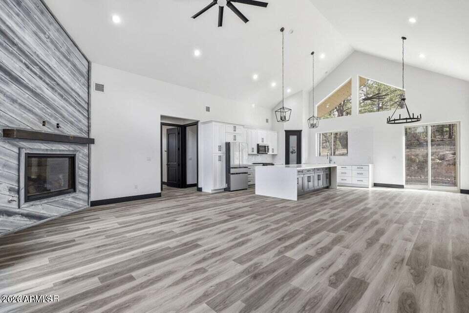 2381 West Bench Road Show Low, AZ 85901 - Photo 8 of 45 a view of a kitchen with a sink and a fireplace