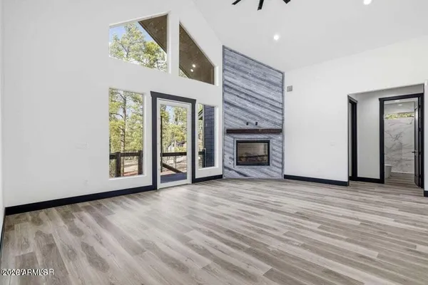 a view of a room with cabinet and wooden floor