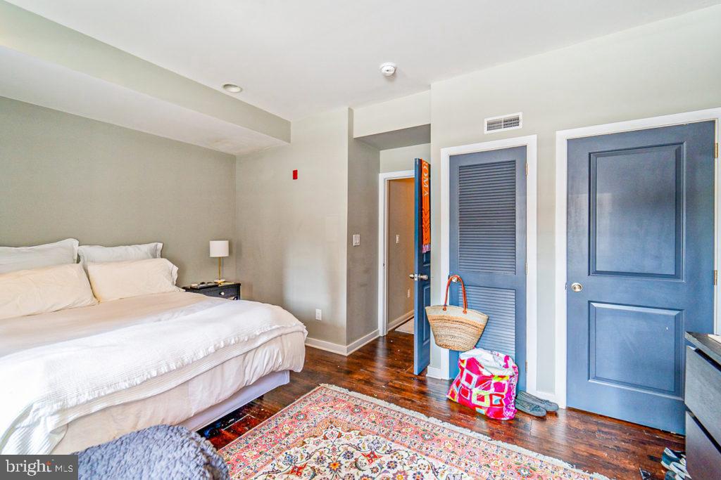 19 North 3rd Street Philadelphia, PA 19106 - Photo 13 of 14 a bedroom with a bed and wooden floor