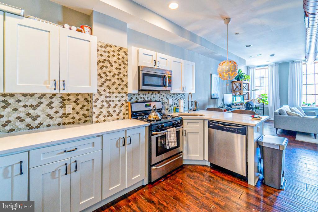 19 North 3rd Street Philadelphia, PA 19106 - Photo 7 of 14 a kitchen with a sink stove and cabinets