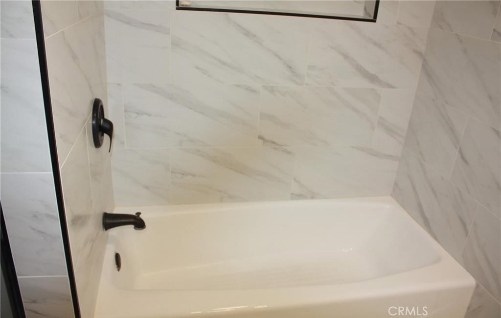 3585 Timothy Way Riverside, CA 92506 - Photo 12 of 14 a bathroom with a bathtub