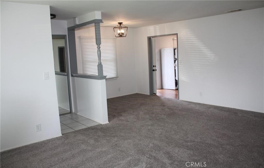 3585 Timothy Way Riverside, CA 92506 - Photo 6 of 14 a view of empty room with wooden floor