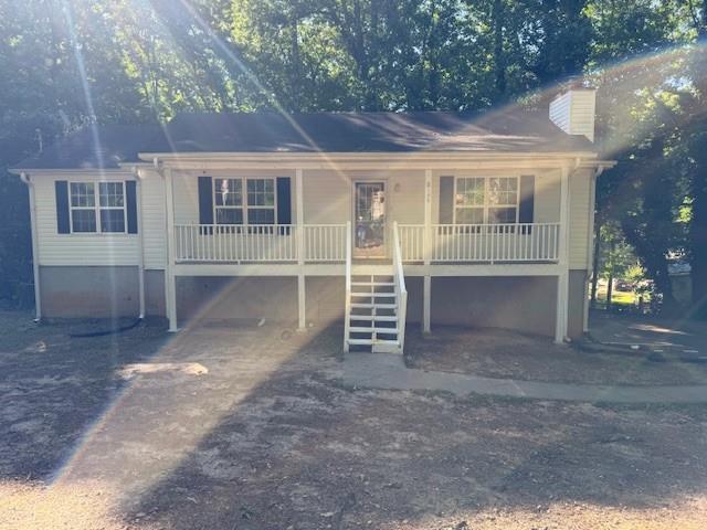 2196 Stenger Road Douglasville, GA 30135 - Photo 2 of 13 front view of a house with a yard