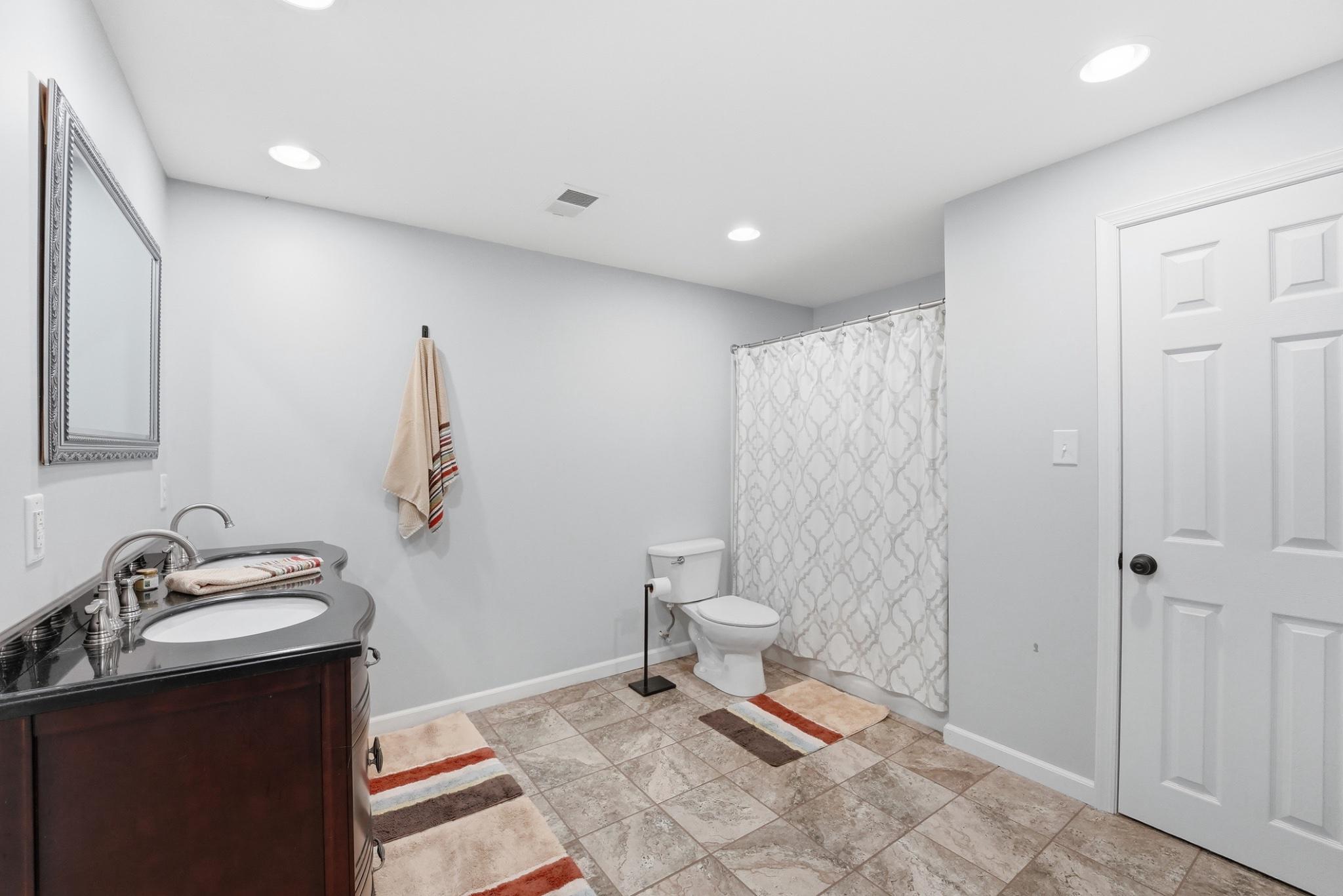 11337 Old Stillhouse Road Boston, VA 22713 - Photo 48 of 58 a bathroom with a sink toilet and shower
