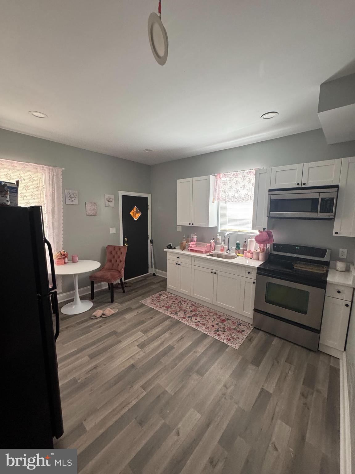 4303 York Road Baltimore, MD 21212 - Photo 11 of 21 a living room with a couch and a stove top oven