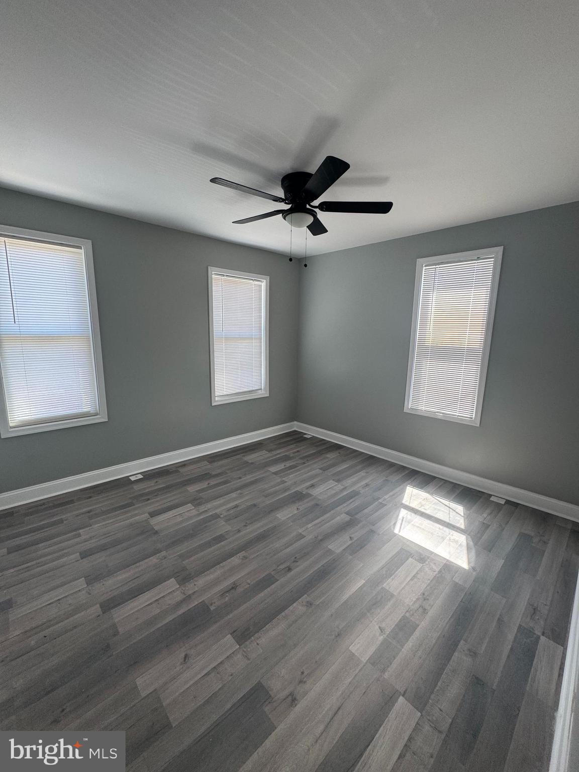 4303 York Road Baltimore, MD 21212 - Photo 8 of 21 a view of empty room with wooden floor and fan