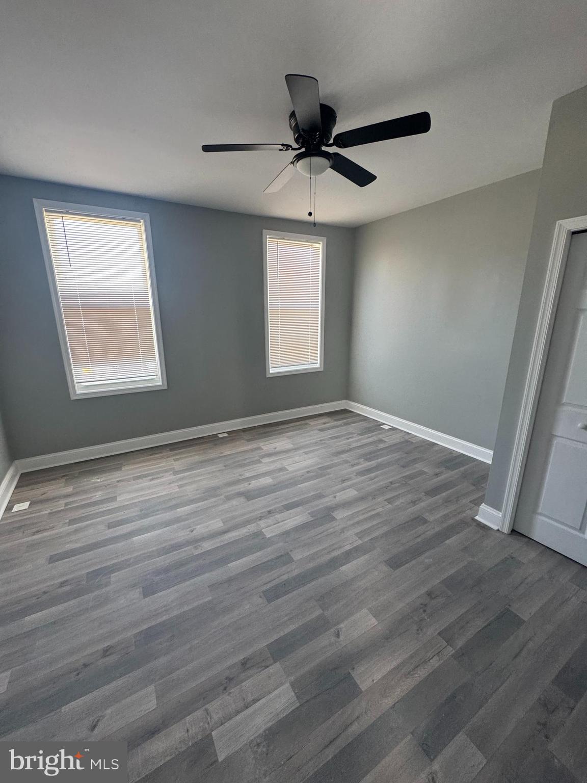 4303 York Road Baltimore, MD 21212 - Photo 10 of 21 wooden floor in an empty room with a window