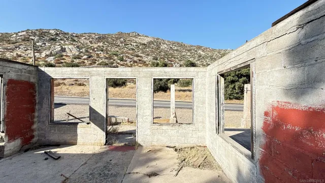 a front view of a house with large windows