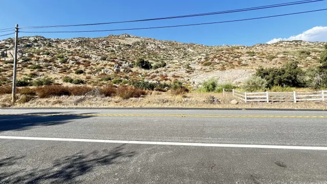 a view of a road with an ocean view