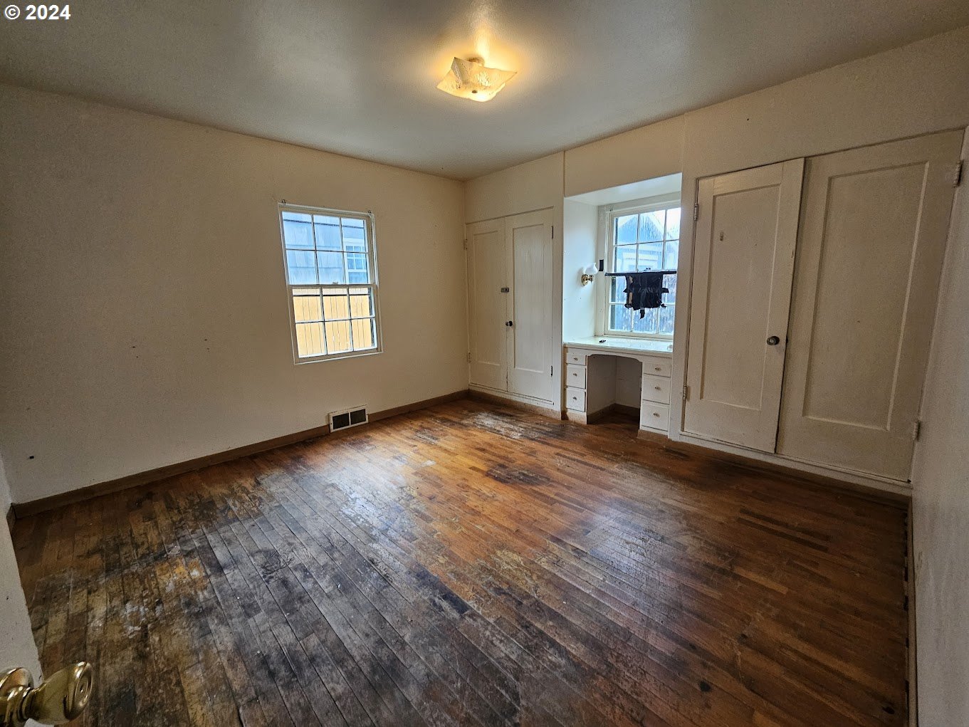 212 North Grant Street Goldendale, WA 98620 - Photo 13 of 15 a view of an empty room with a window and wooden floor