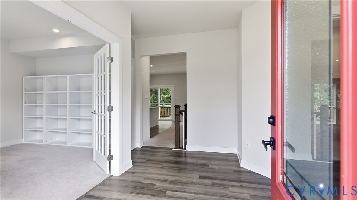 9308 Rudders Point Cove Mechanicsville, VA 23116 - Photo 3 of 50 Red entry door with glass paneling, wood-finish fl