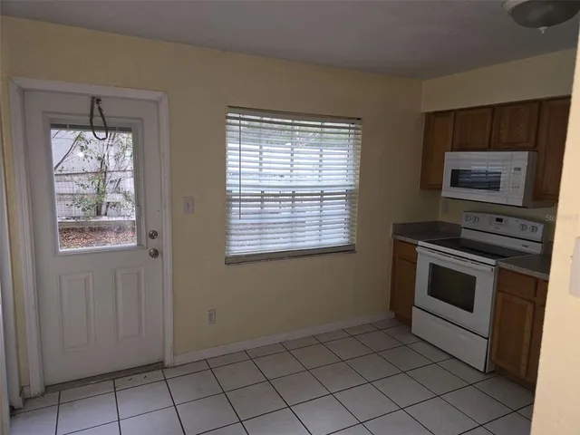 a kitchen with a stove and a microwave