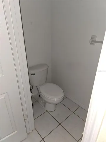 a white toilet sitting next to a sink