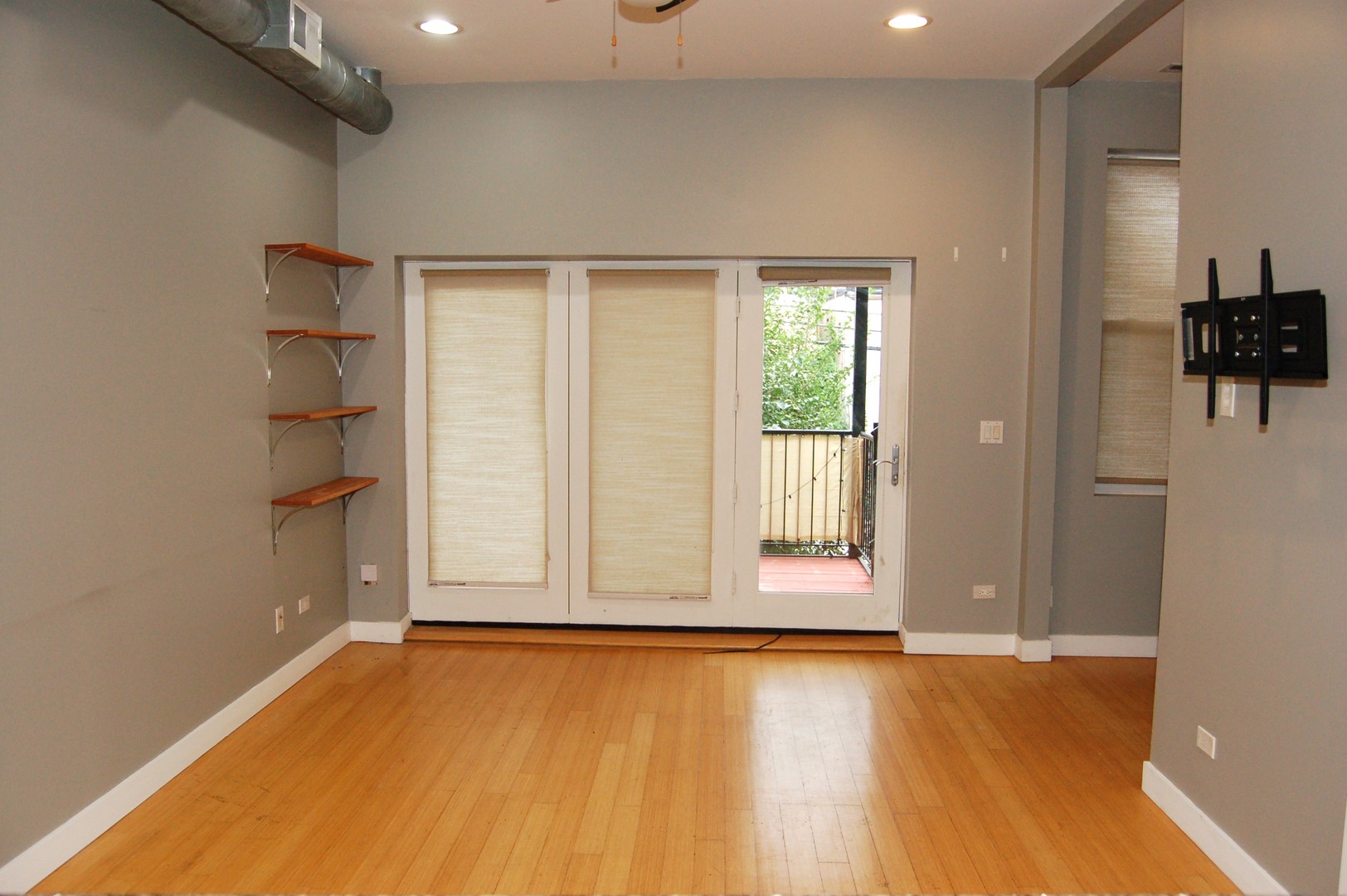 2649 West Haddon Avenue, Unit 2S Chicago, IL 60622 - Photo 6 of 14 an empty room with wooden floor and windows