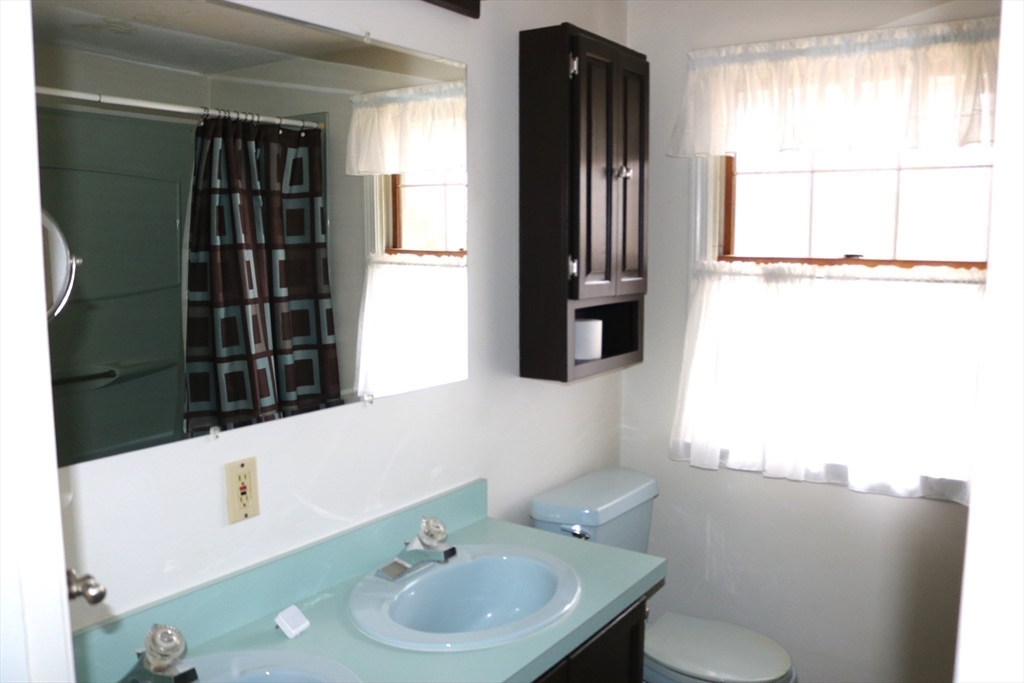 28 Chevy Chase Road Worcester, MA 01606 - Photo 12 of 17 a bathroom with a sink a toilet and shower