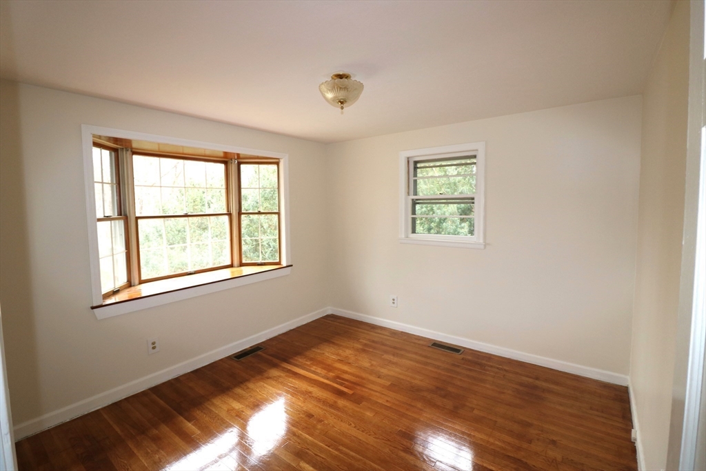 28 Chevy Chase Road Worcester, MA 01606 - Photo 7 of 17 an empty room with wooden floor and windows
