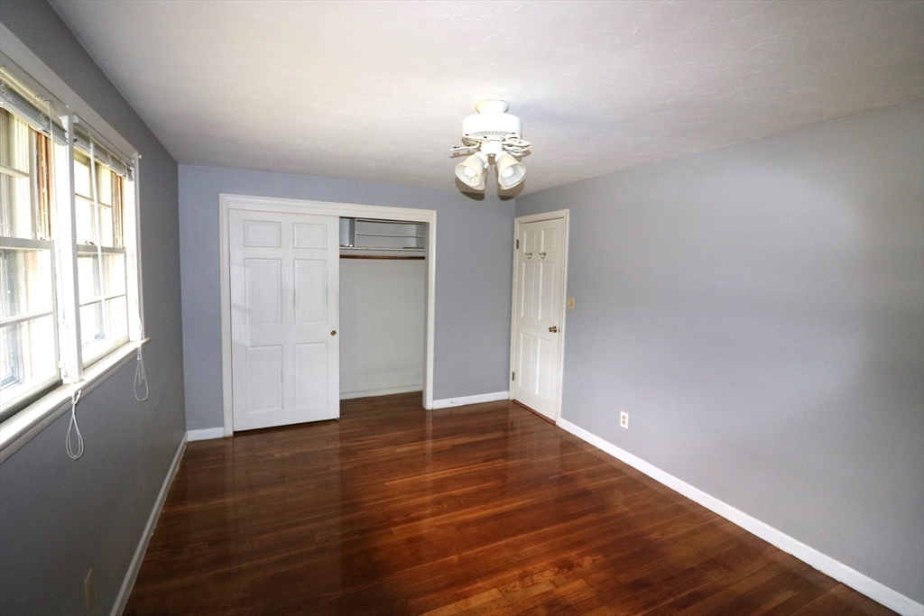 28 Chevy Chase Road Worcester, MA 01606 - Photo 8 of 17 an empty room with wooden floor and windows