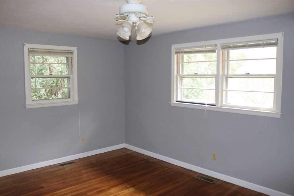 28 Chevy Chase Road Worcester, MA 01606 - Photo 9 of 17 an empty room with wooden floor and windows