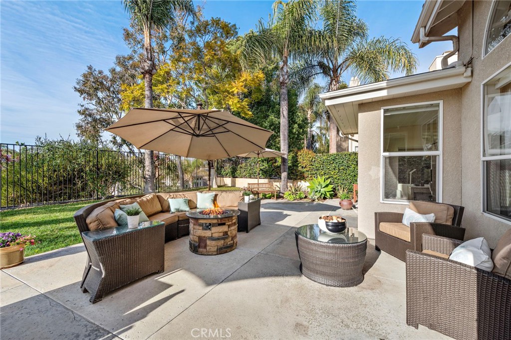 2004 Via Solona San Clemente, CA 92673 - Photo 12 of 20 a view of a patio with couches table and chairs under an umbrella