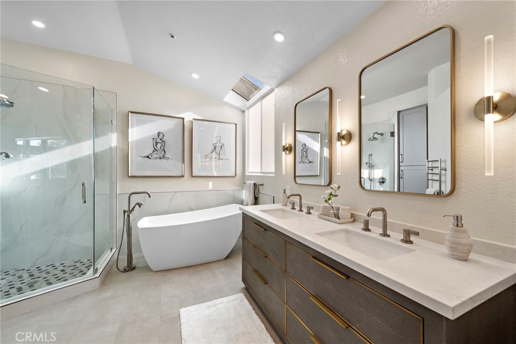 2004 Via Solona San Clemente, CA 92673 - Photo 15 of 20 a bathroom with a tub double sink window and mirror