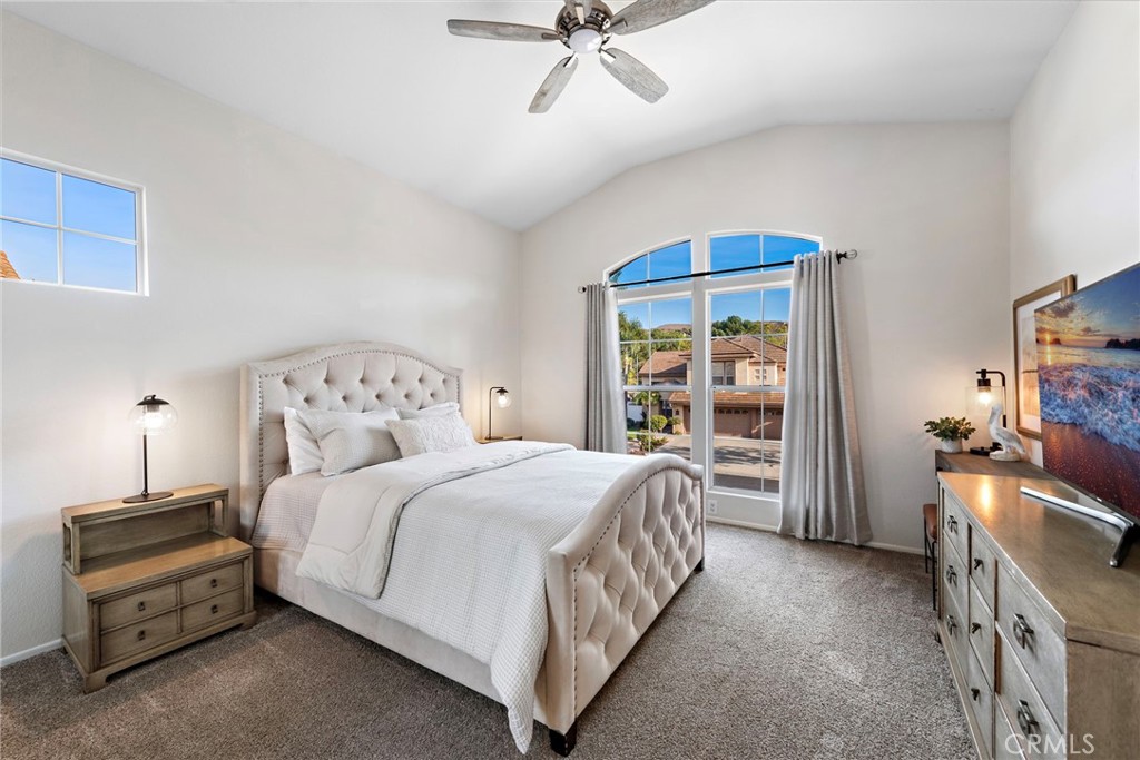 2004 Via Solona San Clemente, CA 92673 - Photo 16 of 20 a bedroom with a bed and a chandelier
