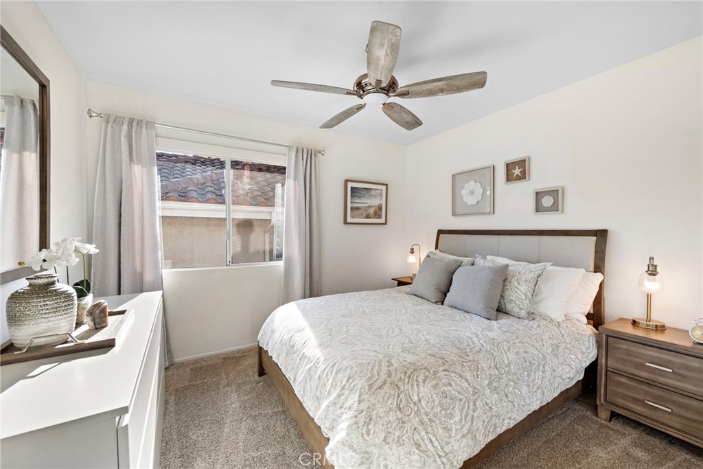2004 Via Solona San Clemente, CA 92673 - Photo 18 of 20 a bedroom with a bed and wooden floor