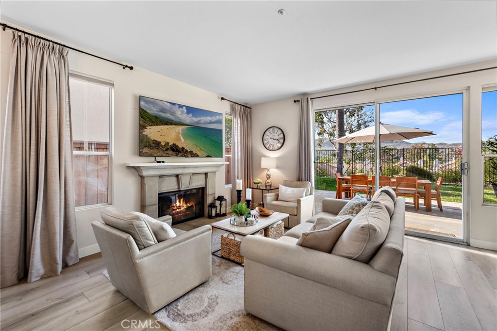 2004 Via Solona San Clemente, CA 92673 - Photo 6 of 20 a living room with furniture a fireplace and a flat screen tv