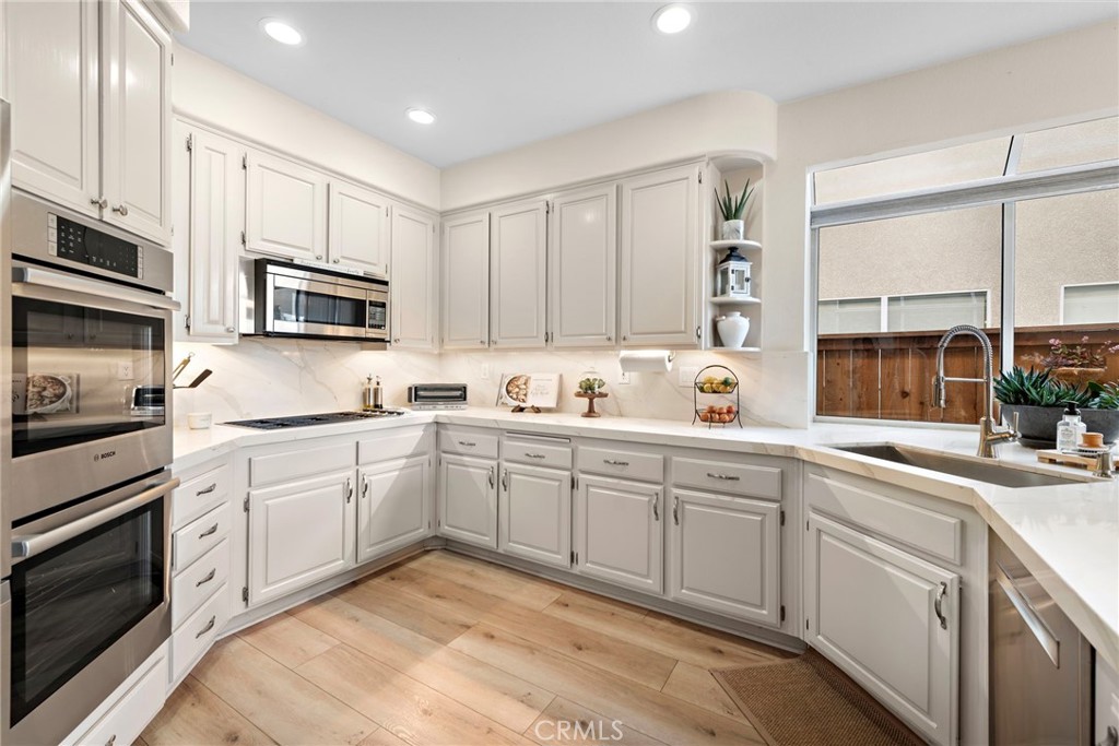 2004 Via Solona San Clemente, CA 92673 - Photo 8 of 20 a kitchen with cabinets appliances a sink and a window