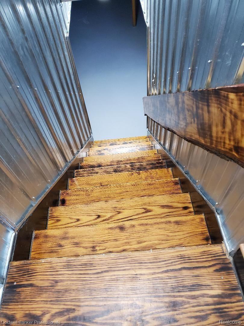 11315 Lambs Road Memphis, MI 48041 - Photo 39 of 62 Oak Steps to basement with Live Edge Rail