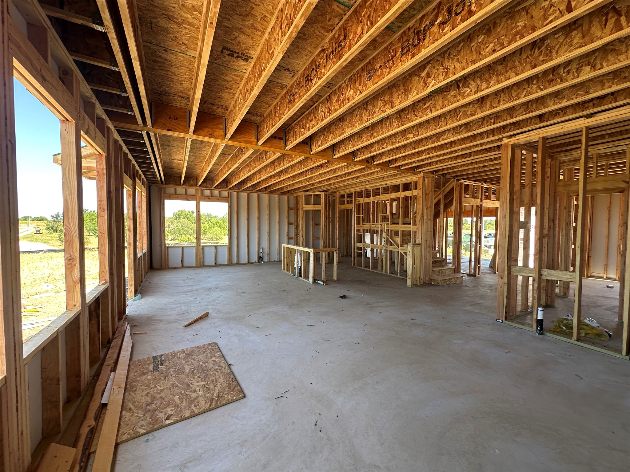 25517 Flora Bella Lane Elgin, TX 78621 - Photo 1 of 33 Solid new construction offers ample space with sturdy framing ready for finishing touches.