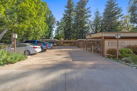 a view of street with parked cars