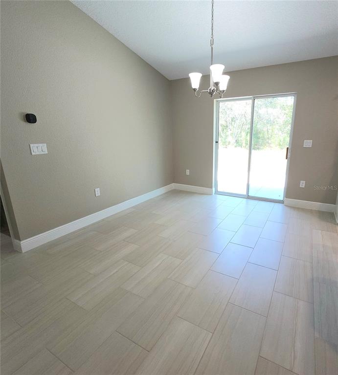 7794 North Keystone Drive Citrus Springs, FL 34433 - Photo 5 of 14 a view of an empty room with a window