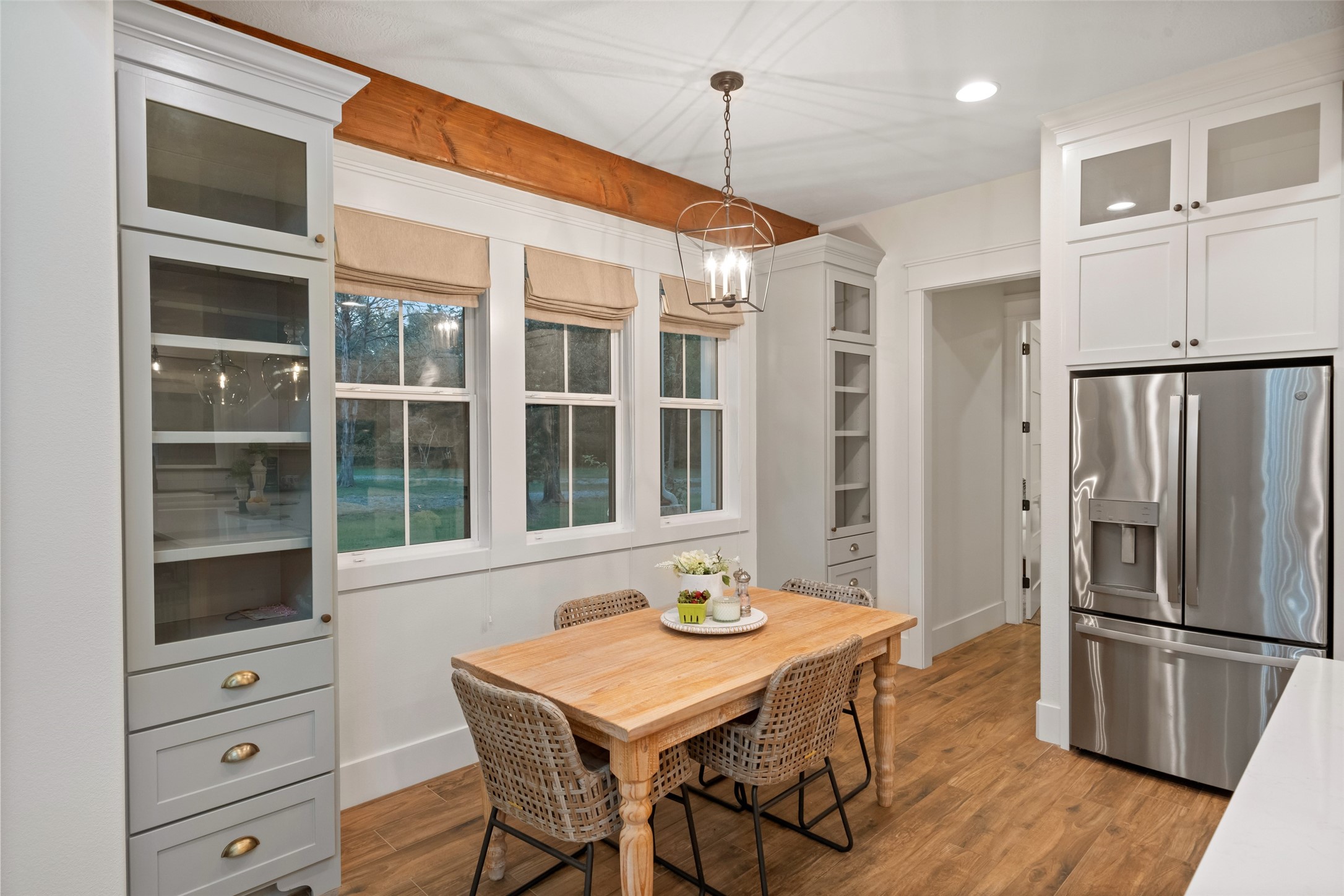 27201 Double Culvert Road Hempstead, TX 77445 - Photo 22 of 48 a kitchen with stainless steel appliances granite countertop a refrigerator a oven and white cabinets with wooden floors
