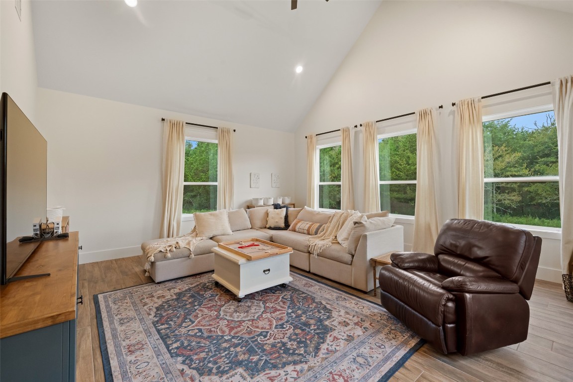 27201 Double Culvert Road Hempstead, TX 77445 - Photo 24 of 49 Secondary living area with vaulted ceilings and large windows offers plenty of natural light and backyard views.
