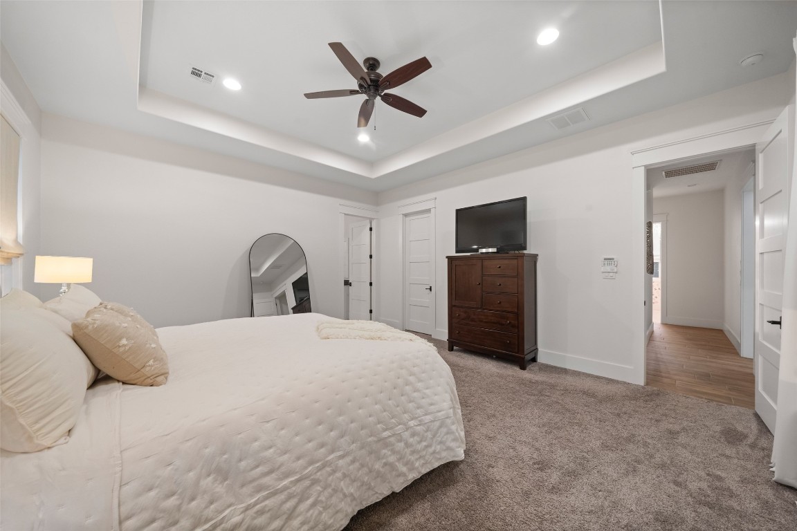 27201 Double Culvert Road Hempstead, TX 77445 - Photo 29 of 49 Another perspective of the primary suite reveals its spacious layout, plush carpeting, and direct access to adjoining areas.