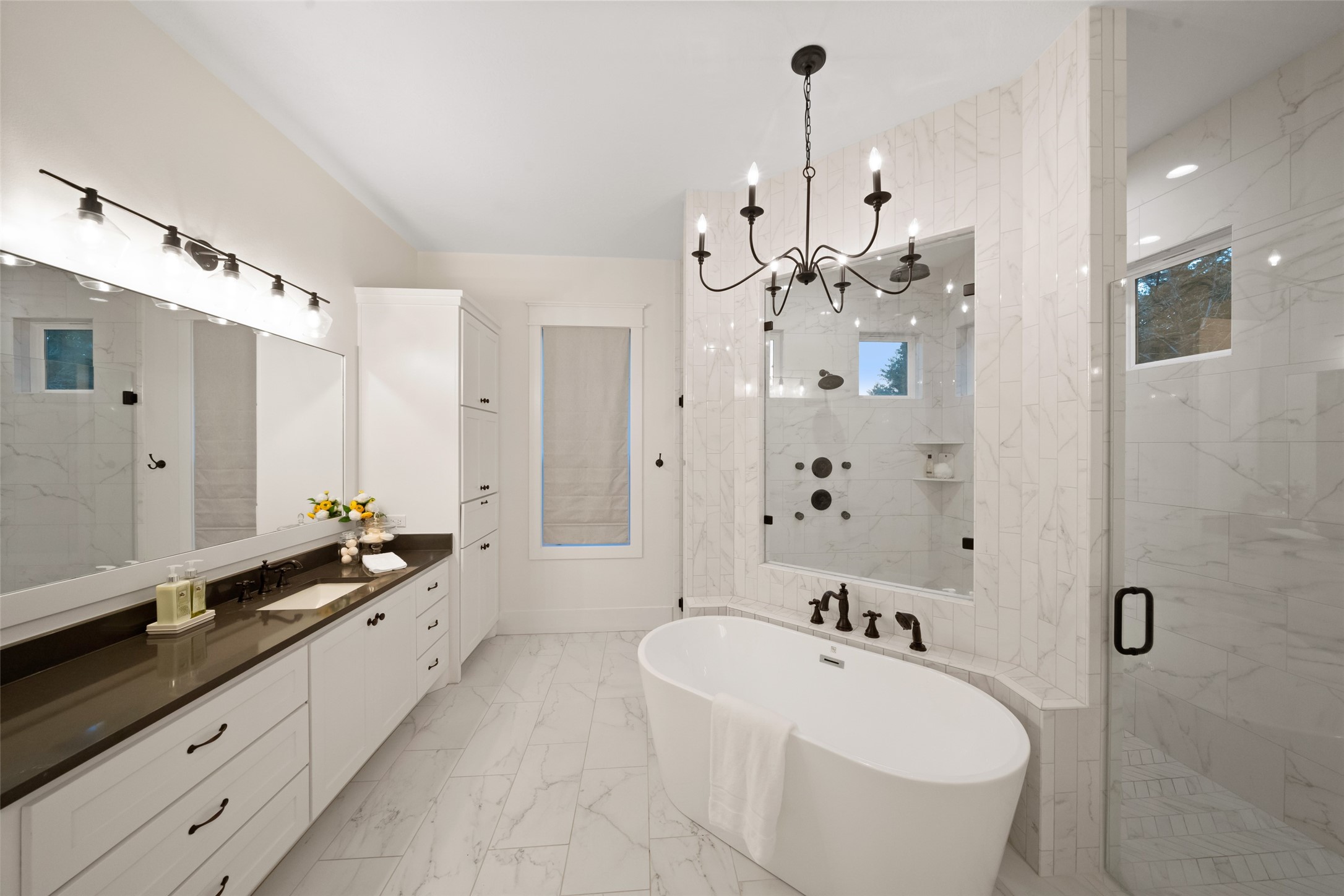 27201 Double Culvert Road Hempstead, TX 77445 - Photo 31 of 48 a large bathroom with a bathtub sink mirror and shower