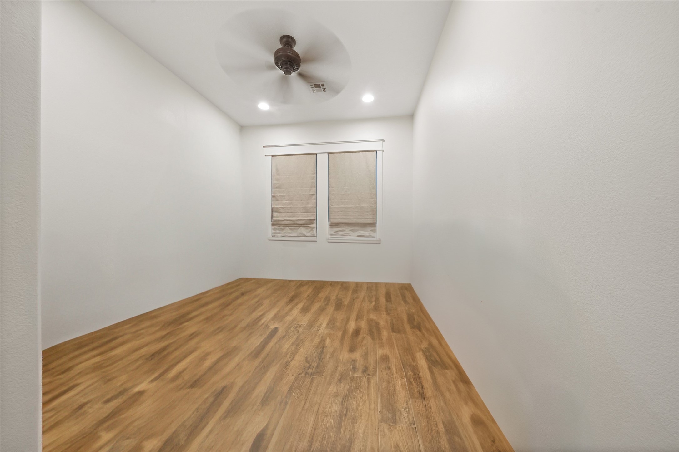 27201 Double Culvert Road Hempstead, TX 77445 - Photo 34 of 49 Unstaged, the bonus room offers clean lines, wood-look flooring, and ample potential for a custom workspace or retreat.