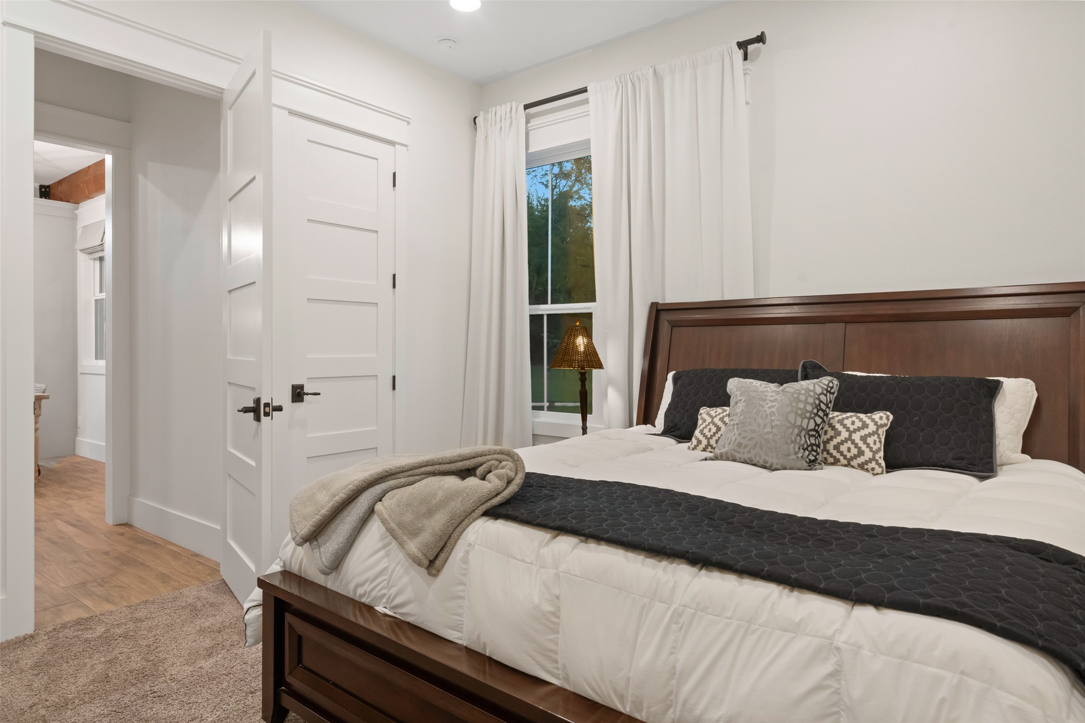 27201 Double Culvert Road Hempstead, TX 77445 - Photo 35 of 49 Secondary bedroom with large window, soft carpet underfoot, and neutral tones ready for personal styling.