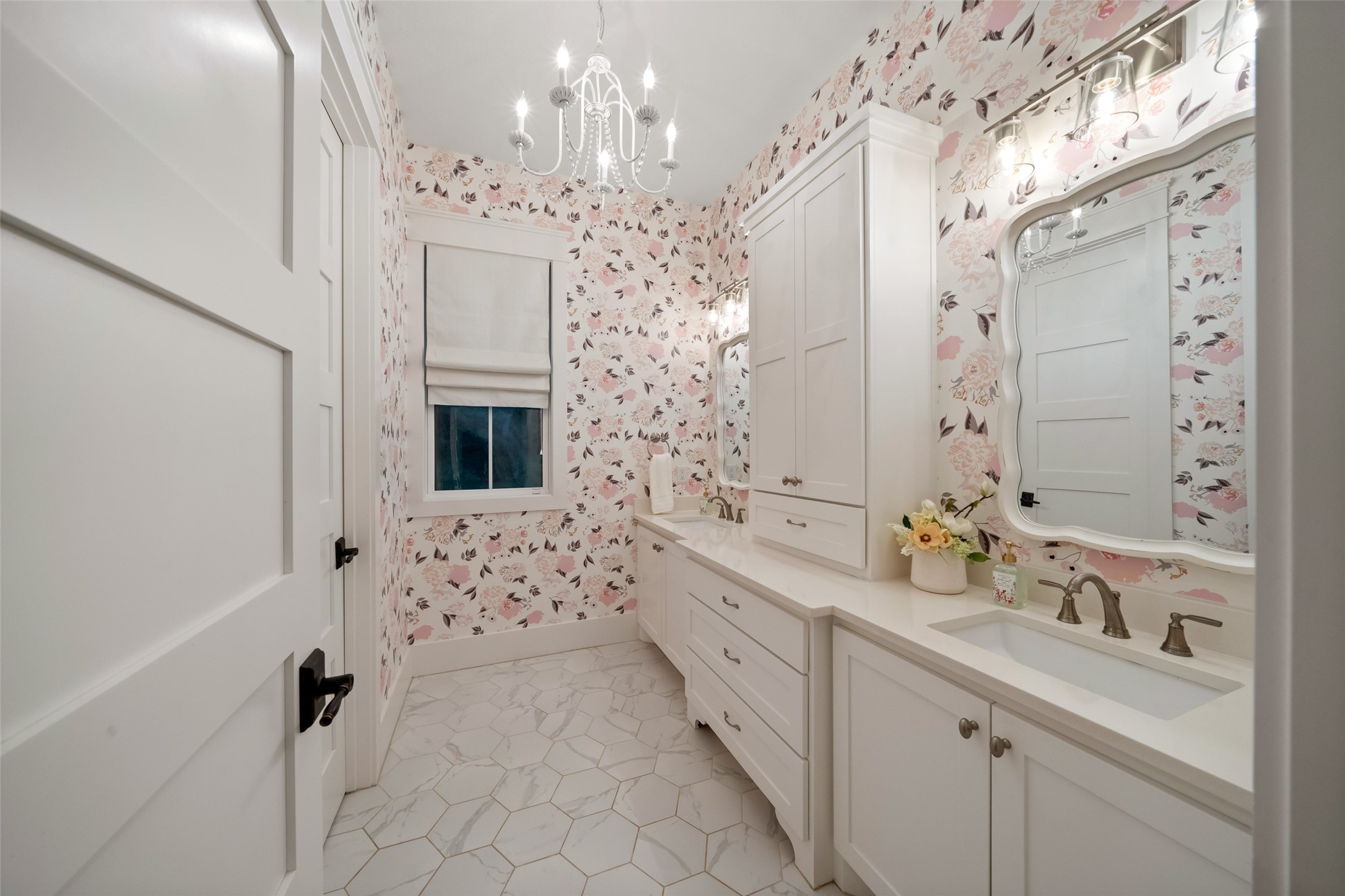 27201 Double Culvert Road Hempstead, TX 77445 - Photo 36 of 49 Bathroom with playful floral wallpaper, dual vanities, and elegant tile flooring—bright and cheerful in design.